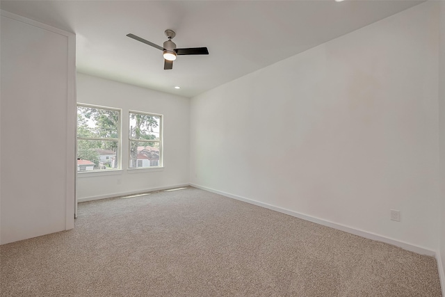 unfurnished room with carpet floors and ceiling fan