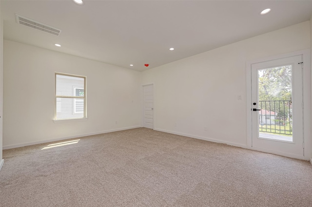 spare room with light carpet