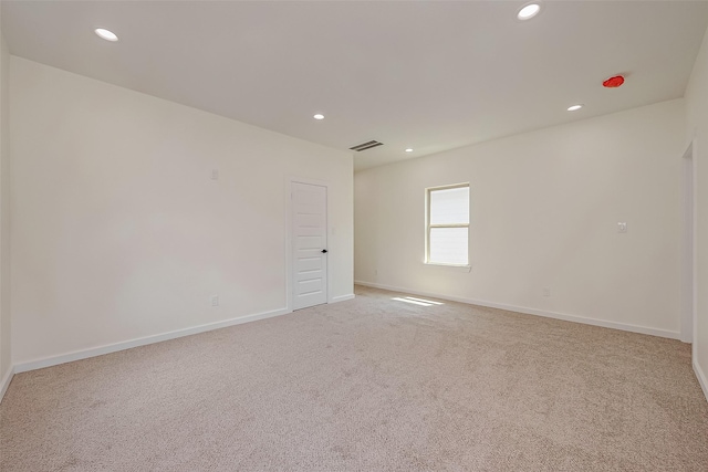 empty room with light colored carpet