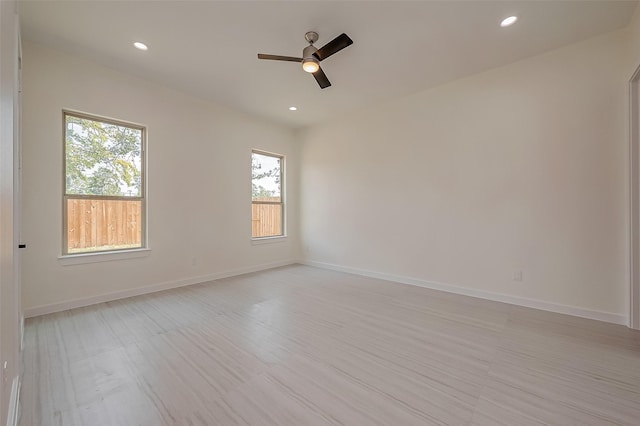 unfurnished room with ceiling fan