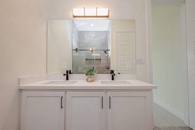 bathroom with vanity and walk in shower