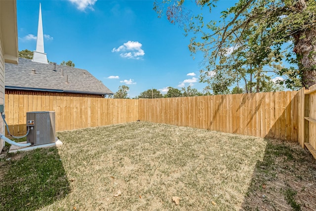 view of yard with central AC unit