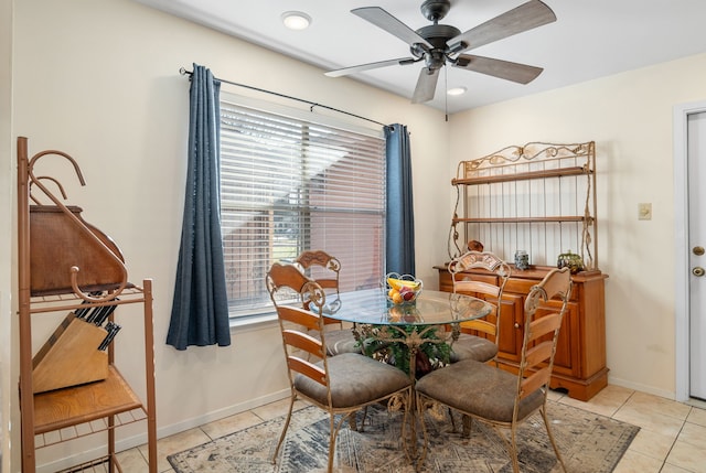 tiled dining area featuring ceiling fan and plenty of natural light