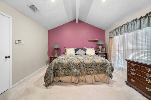 carpeted bedroom featuring lofted ceiling with beams and a textured ceiling