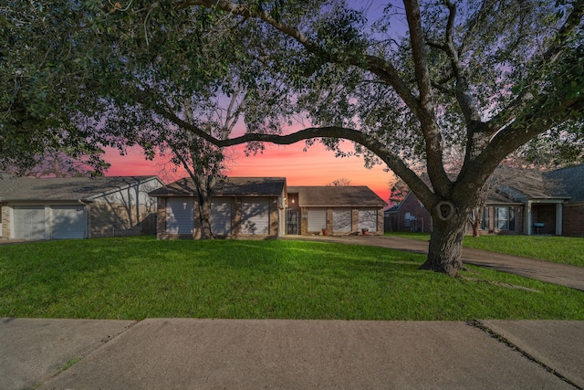 ranch-style home featuring a lawn