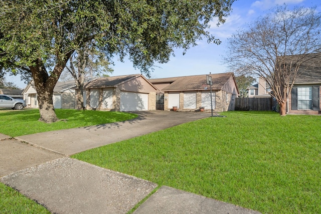 single story home featuring a garage and a front yard