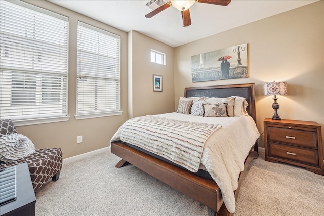 bedroom with light colored carpet and ceiling fan