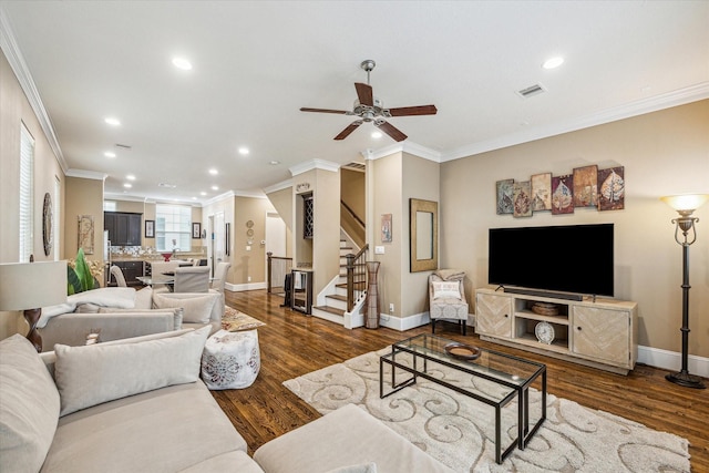 living room featuring ornamental molding, dark hardwood / wood-style floors, and ceiling fan