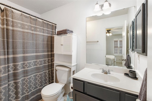 bathroom with vanity, ceiling fan, and toilet