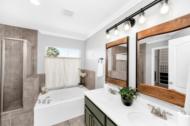 bathroom featuring crown molding, separate shower and tub, vanity, and tile patterned floors