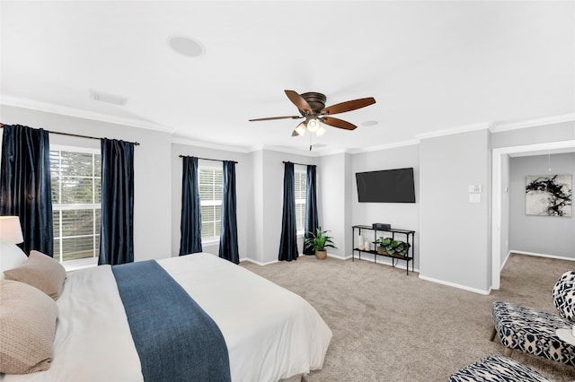 carpeted bedroom featuring multiple windows, crown molding, and ceiling fan