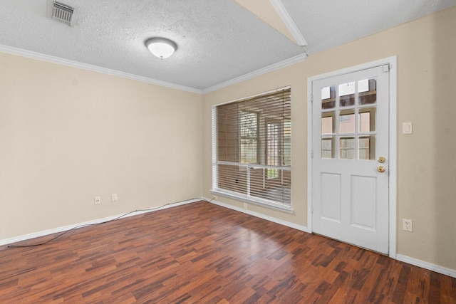 spare room featuring ornamental molding, dark hardwood / wood-style flooring, and a textured ceiling