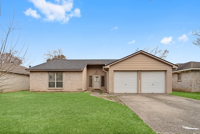 single story home featuring a garage and a front lawn