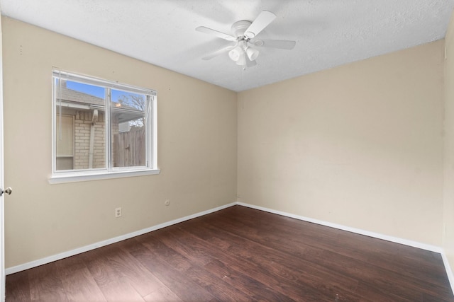 spare room featuring ceiling fan, wood-type flooring, and a textured ceiling