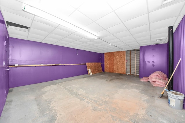 basement featuring a drop ceiling