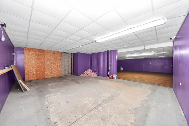 basement featuring a drop ceiling