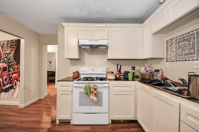 kitchen featuring white range with electric cooktop, dark wood-style floors, dark countertops, and under cabinet range hood