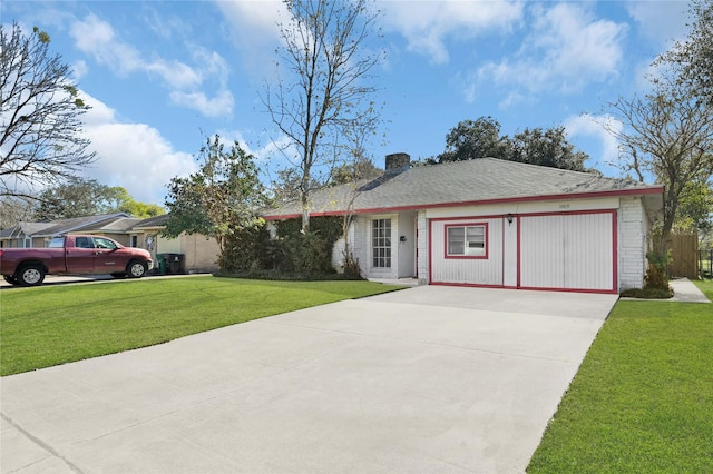 single story home with a garage and a front lawn