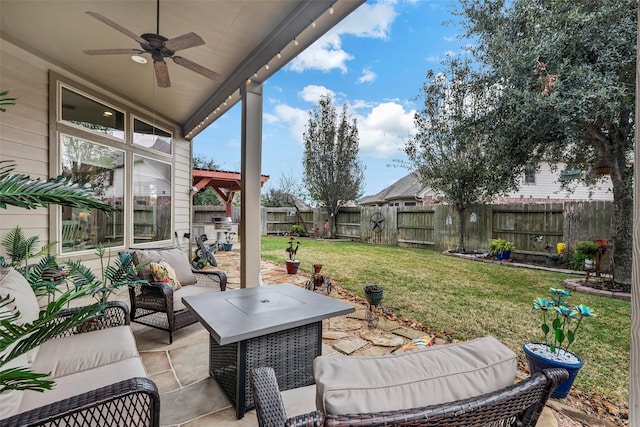 view of patio with an outdoor living space and ceiling fan