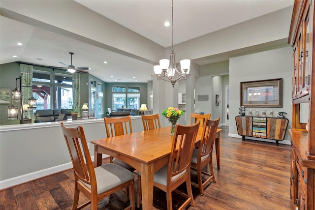 dining space featuring lofted ceiling, dark hardwood / wood-style floors, and ceiling fan with notable chandelier