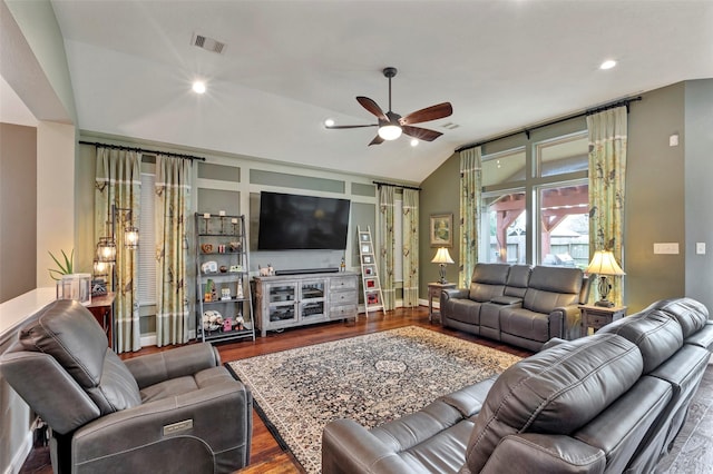 living room with hardwood / wood-style flooring, ceiling fan, and lofted ceiling