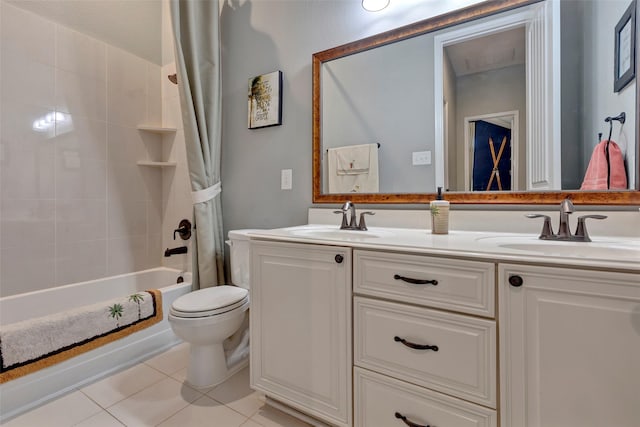 full bathroom with shower / bathtub combination with curtain, vanity, tile patterned floors, and toilet