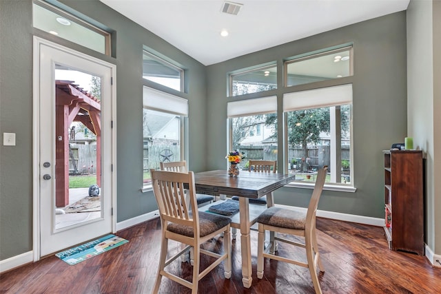 dining space with dark wood-type flooring