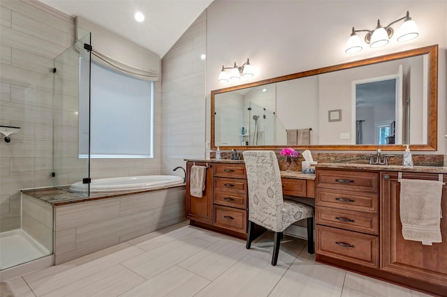 bathroom with lofted ceiling, vanity, and plus walk in shower