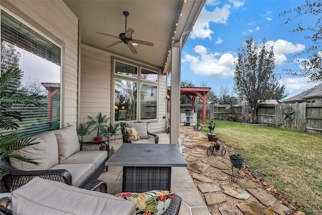 view of patio with outdoor lounge area and ceiling fan