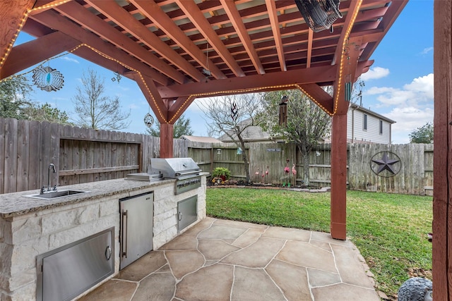 view of patio with area for grilling, grilling area, and sink