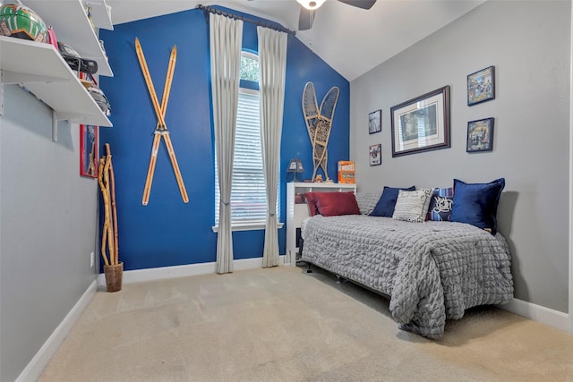 bedroom with lofted ceiling, ceiling fan, and carpet