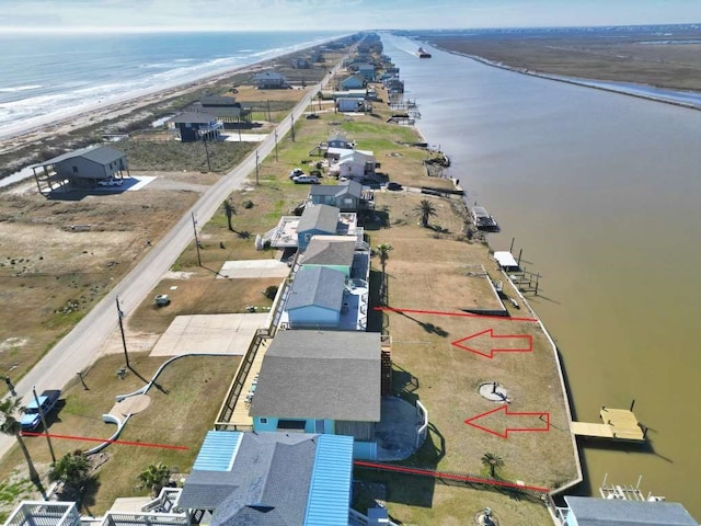 aerial view featuring a beach view and a water view