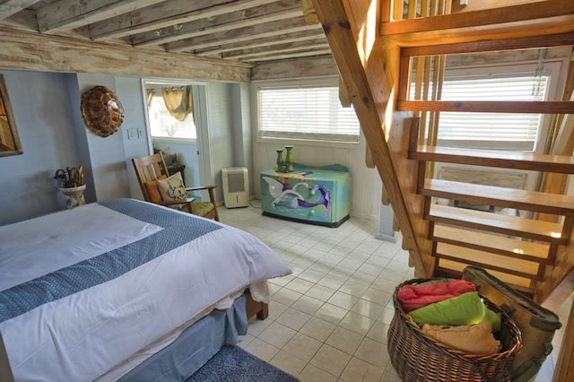 bedroom featuring light tile patterned flooring