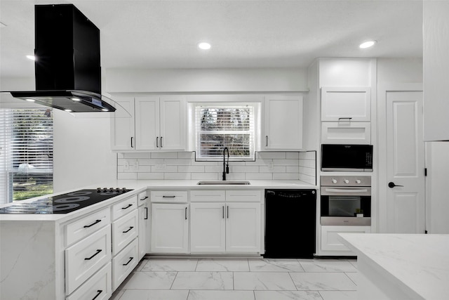 kitchen with tasteful backsplash, sink, white cabinets, island exhaust hood, and black appliances