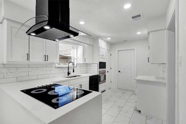 kitchen featuring sink, island range hood, black appliances, and white cabinets