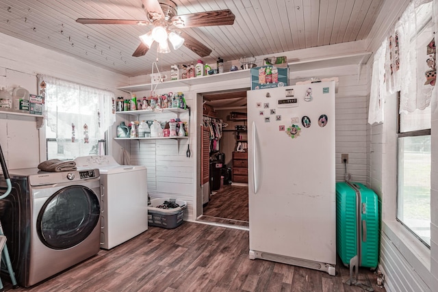 clothes washing area with dark hardwood / wood-style flooring, a wealth of natural light, washer and clothes dryer, and wooden ceiling