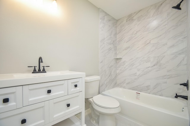 full bathroom with vanity, tiled shower / bath combo, and toilet