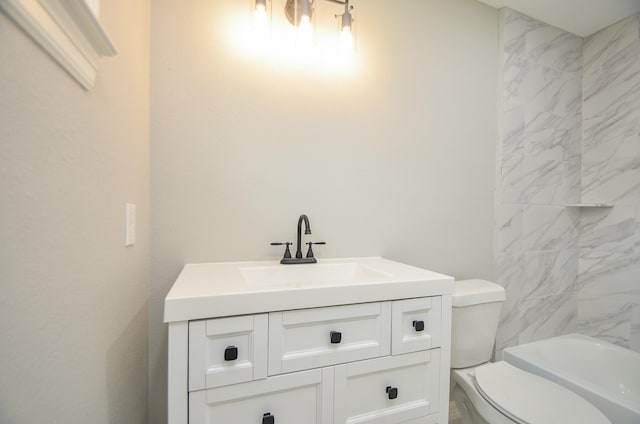 bathroom featuring vanity and toilet