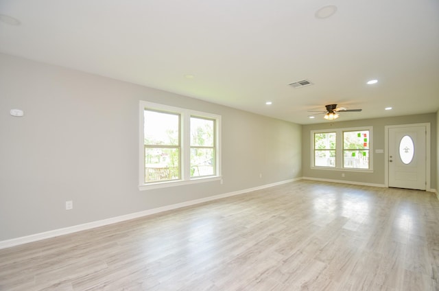 interior space with ceiling fan and light wood-type flooring