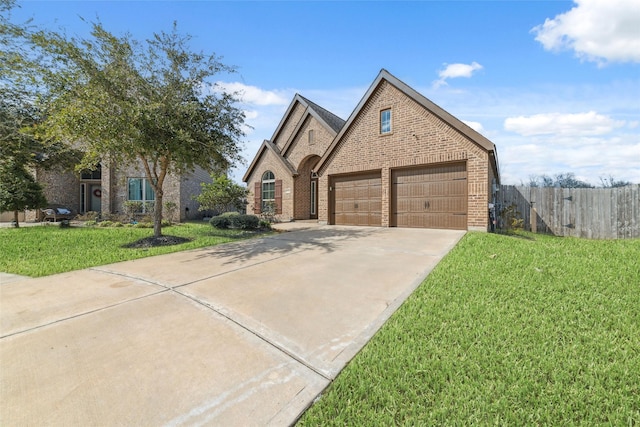 view of front of property with a garage and a front yard