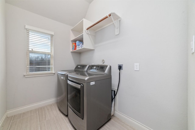 washroom with independent washer and dryer