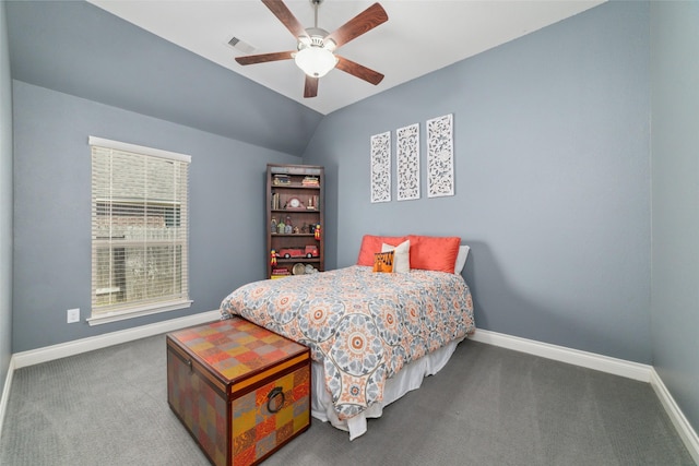 carpeted bedroom with vaulted ceiling and ceiling fan