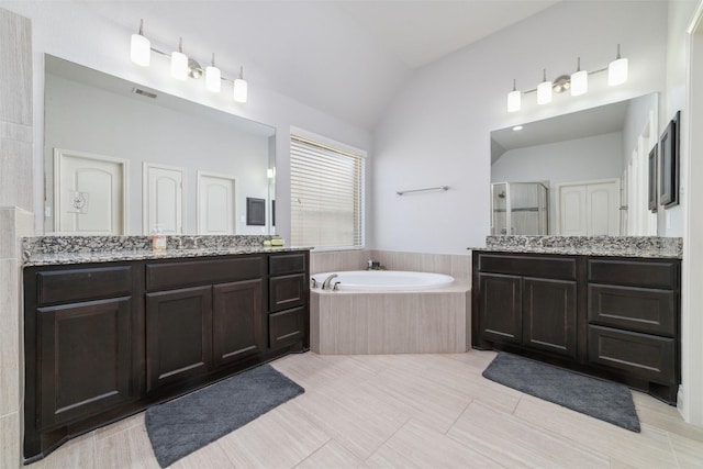 bathroom with lofted ceiling, plus walk in shower, and vanity