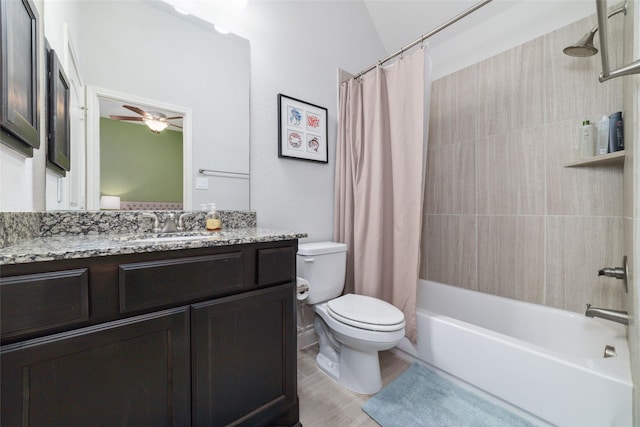 full bathroom with vanity, shower / tub combo with curtain, ceiling fan, and toilet