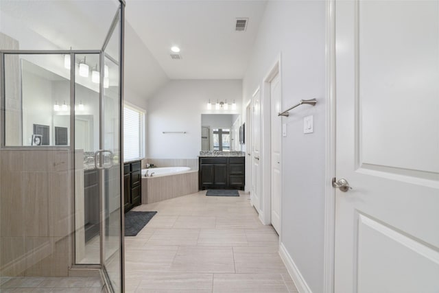 bathroom with vanity, tile patterned floors, and separate shower and tub