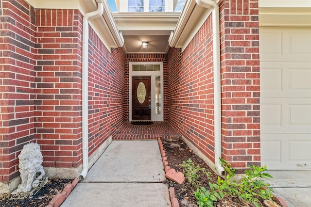 view of exterior entry featuring a garage