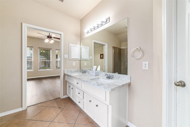 bathroom featuring vanity, tile patterned floors, and ceiling fan