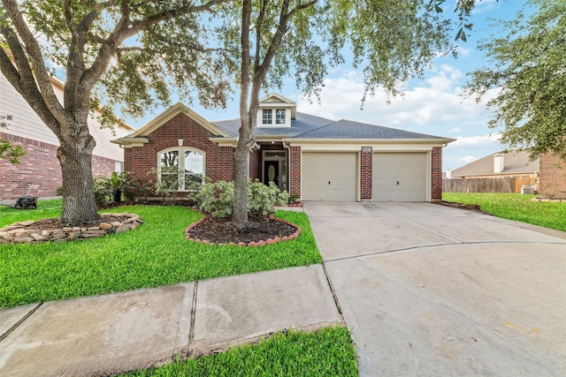 view of front of house featuring a garage and a front yard