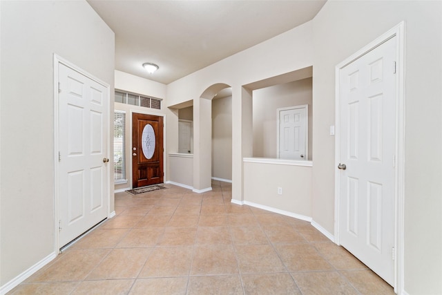 foyer featuring light tile patterned floors