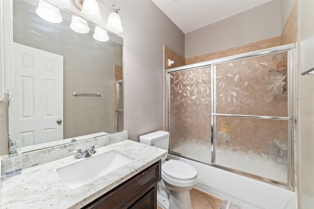 full bathroom featuring enclosed tub / shower combo, vanity, tile patterned floors, toilet, and a chandelier